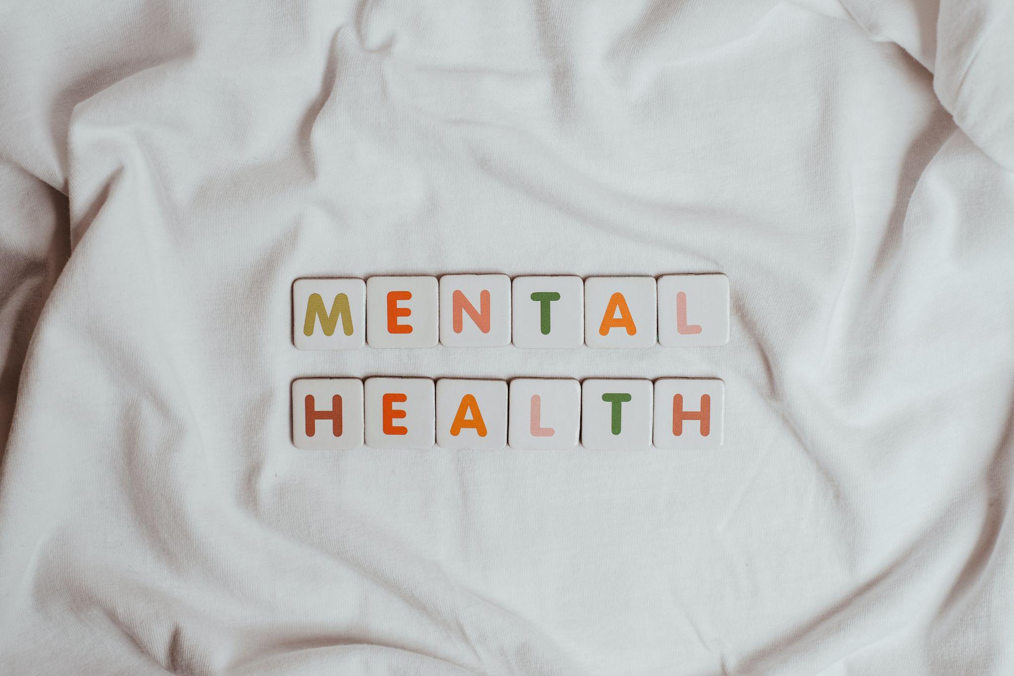 The phrase mental health on a sheet of fabric